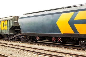 Obraz premium Grain hoppers on the railway track.Railroad Cars. Railroad hopper cars parked on rural tracks all by themselves on a cold winter day. Business Logistics concept.