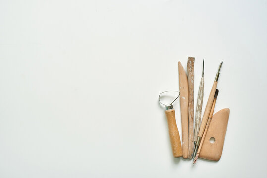 wooden tools for working with clay and ceramics, copy space
