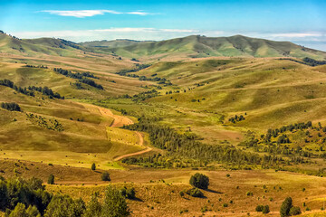 Summer landscape with hills and mountains of the Altai.
