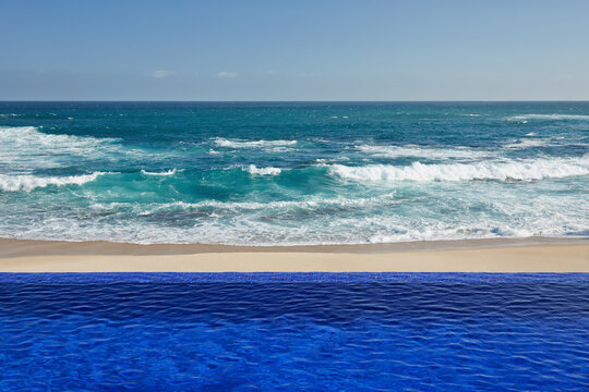 Architecture image of infinity pool on beach and ocean