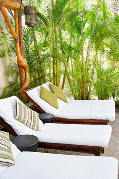 Chaise loungers in outdoor waiting room at luxury spa