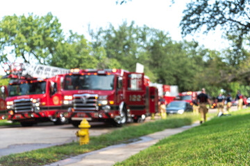 Blurry fireman rescue house fire accident at residential area in suburbs Dallas, Texas, America