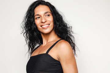 Beautiful latino model wearing a black swimsuit