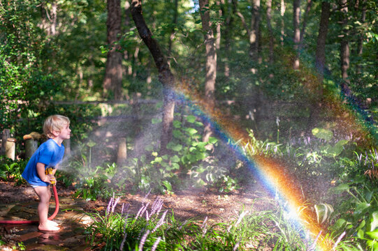 Spraying a Garden Hose and making Rainbows
