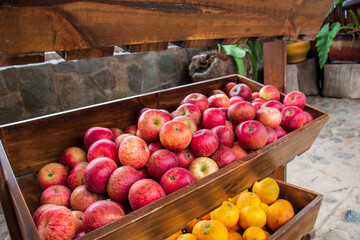 Red wild apples in a wooden crib. Delicious apples. Malus sylvestris
