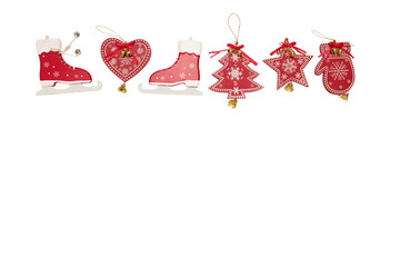Red Christmas wooden flat toys with ornament and bells with sparkles in a row isolated on white. Christmas card.
