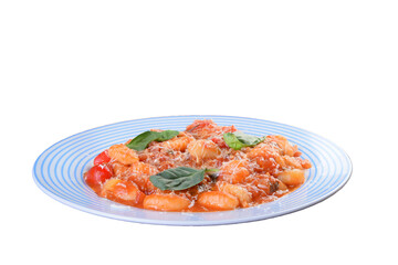 Pasta gnocchi in red sauce with parmesan cheese, tomato, basil, herbs, delicious food of Italian and French cuisine, isolated on white background.