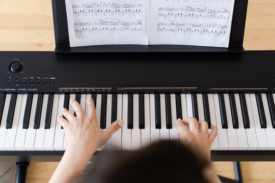 Pianist hands on musical keyboard