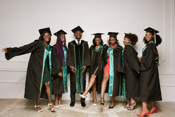 Smiling students in the academic dresses