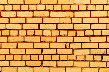 Obraz premium Texture of a brick wall with cracks and scratches which can be used as a background
