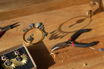 jewelry and tools on a working table