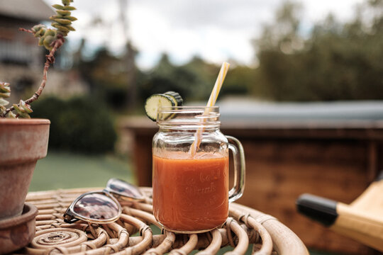 Summer tomato juice with cucumber slices 