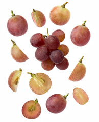 Falling red grape , isolated on white background, selective focus