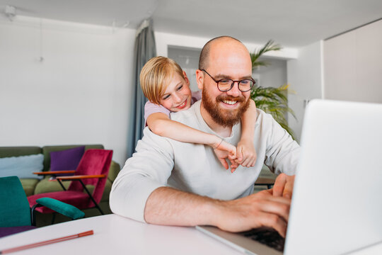 Father and Son Doing Homework Together 