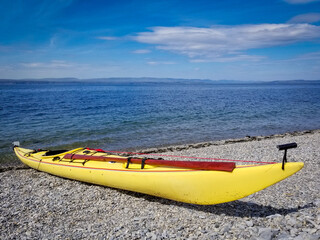 Sea kayak with traditional Greenland style paddle.