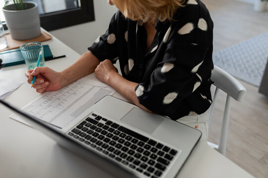 Woman working sitting on the desk at office