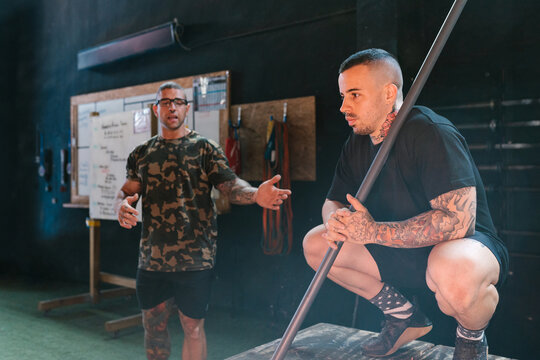 Physical trainers making a technical demonstration