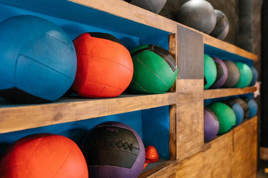 Colorful balls on shelves in gym