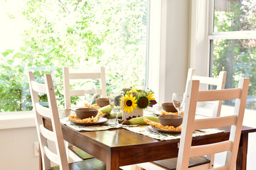 Autumn Thanksgiving table decor and place settings for festive family dinner, home life interior background. Copy space, house and home background, living