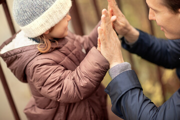 happy family walking in autumn park daughter play with father in nature septembers elective focus