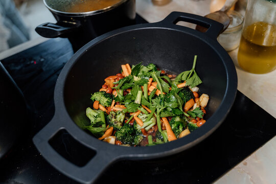 Pot with vegetables on the stove