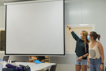 Two young womans giving a business presentation 