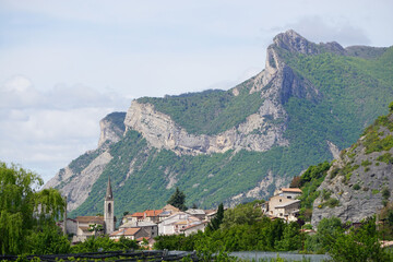 view of village in the mountains and orchards southern france