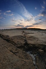Fototapeta na wymiar Sunset fisheye on sandstone rock