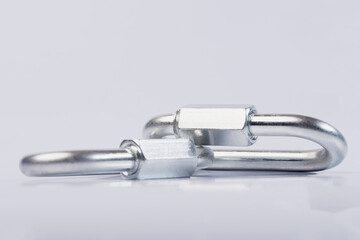 Metal snap hooks on a white isolated background.Spring carabiner made of stainless steel, heavy duty carabiner with quick release lock. 