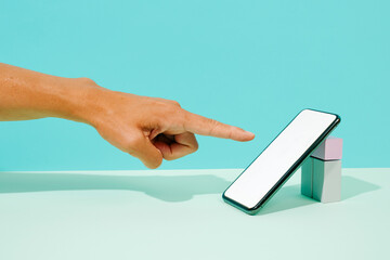 about to touch the screen of a smartphone