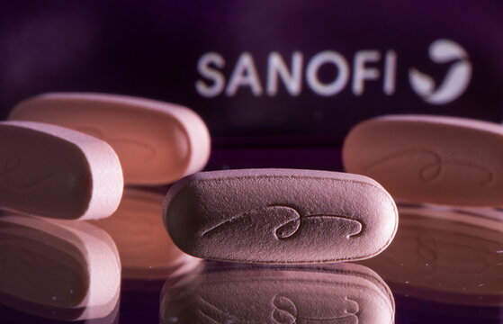 Allegra tablets are seen in front of a box with the Sanofi logo in this illustration