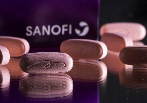 Allegra tablets are seen in front of a box with the Sanofi logo in this illustration