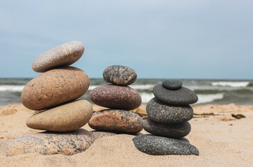 Fototapeta na wymiar A pile of stones stacked on the beach