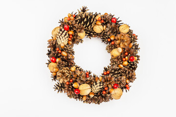 Autumn wreath of cones, nuts, and berries. Creative composition, the handmade