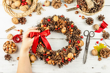 Autumn wreath of cones, nuts, and berries. Assortment from natural materials