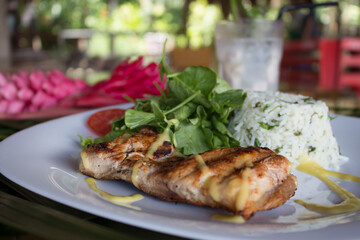 grilled fish with rice and vegetables