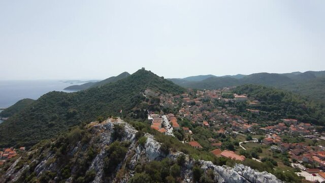 Aerial drone climbing shot revealing old town Lastovo island, Croatia