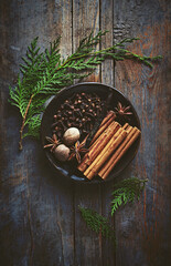 Natural spices for Christmas baking on rustic background. Top view