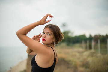 cheerful young girl spending good time at the beach. Beauty portrait. Сute teenage girl or woman on the beach nature landscape fresh air beach. Natural beauty. lifestyle/ real people