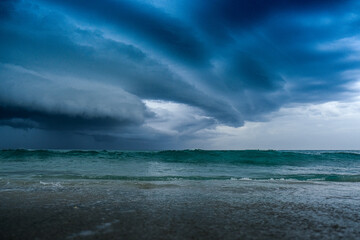 Large shelf cloud of a storm over the ocean