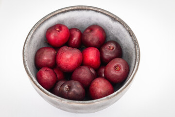 Fresh ripe cherries in a cup on a white background. Dessert. Vegetarian breakfast. Healthy eating.