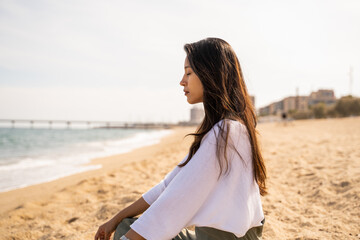Portrait of serene young woman at beach