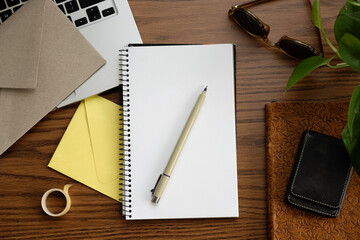 Blank notebook on wooden desk