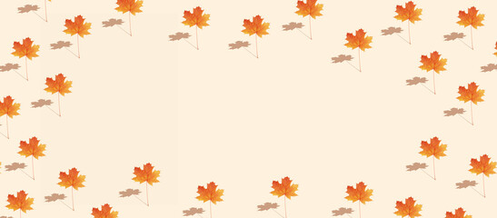 Pattern autumn maple leaf orange-red on orange background in banner format with copy space