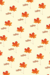 Fototapeta premium Pattern autumn maple leaf orange-red on yellow background in vertical format