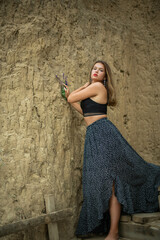 cheerful young girl spending good time at the beach. Beauty portrait. Сute teenage girl or woman on the beach nature landscape fresh air beach. Natural beauty. lifestyle/ real people/ funny/ dance.