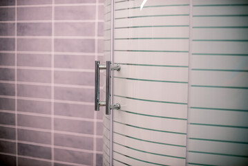 Doors in the bathroom, shower. Glass doors.