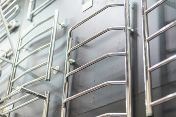 Stainless steel towel rails in a building materials store.