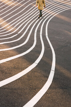 Crop man walking on lines.
