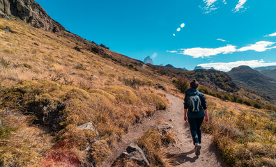 Woman walking along the dirt roads. El chalten, patagonia, Argentina.